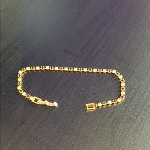 Elegant Gold and Red Bracelet